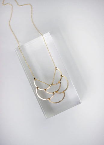 half circle gold necklace